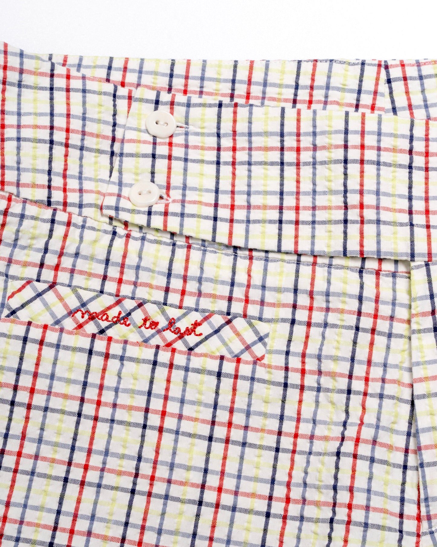 Plaid capris with red and blue lines on a white background