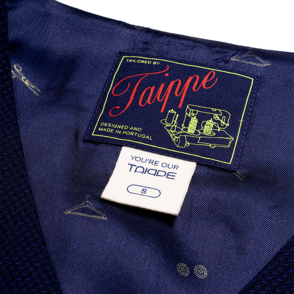 Navy vest with Taippe label and 'You're our Taippe' tag