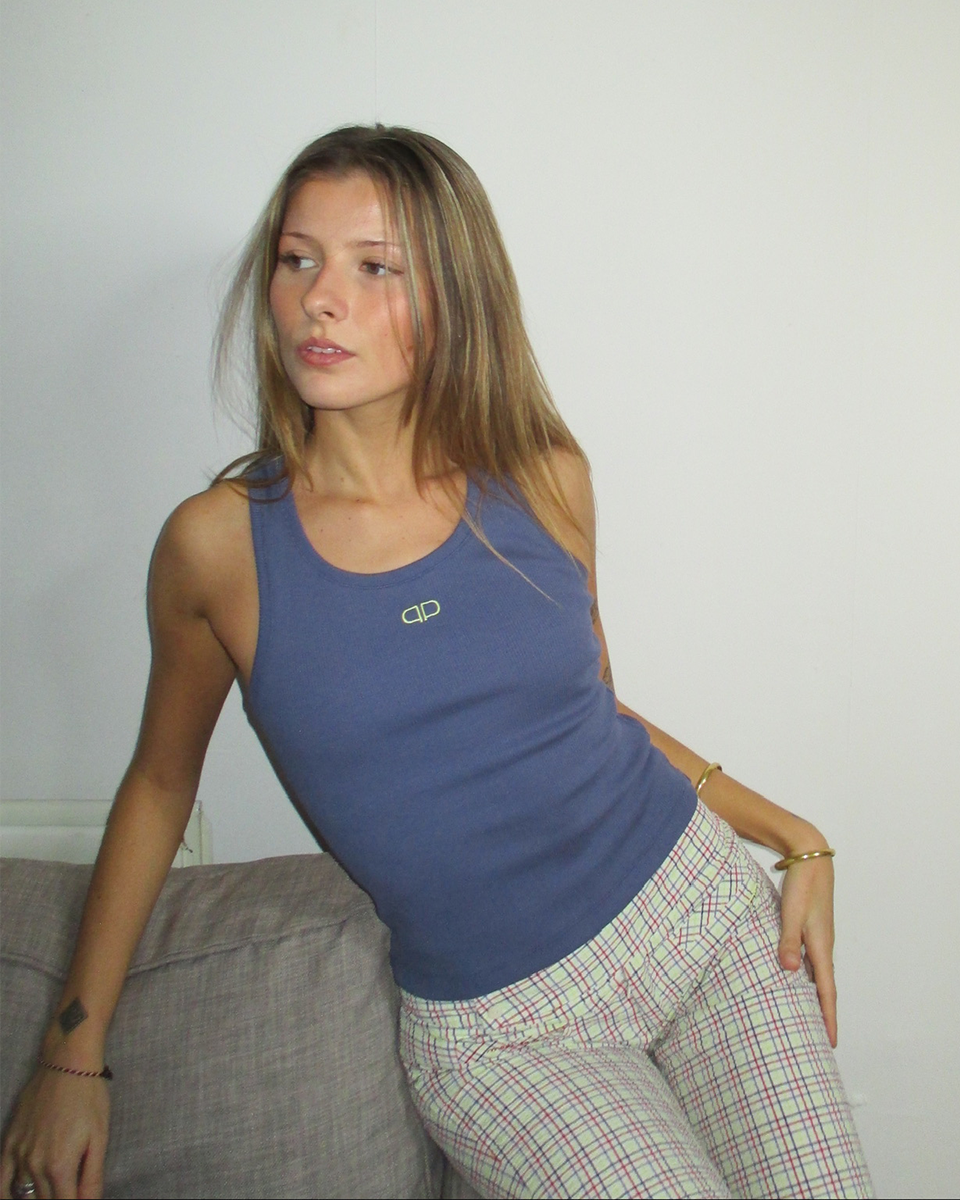 Woman wearing a blue tank top