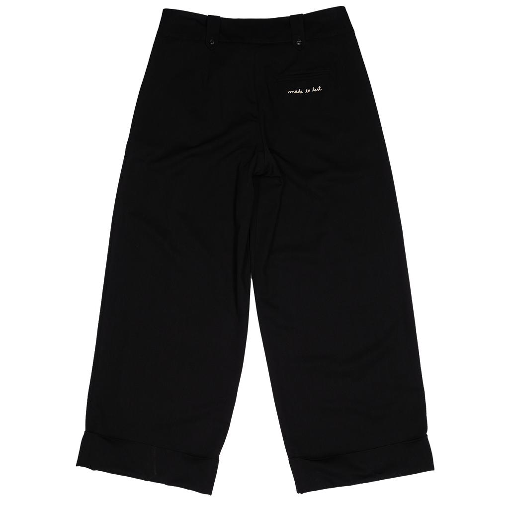 Black pants with text on a white background