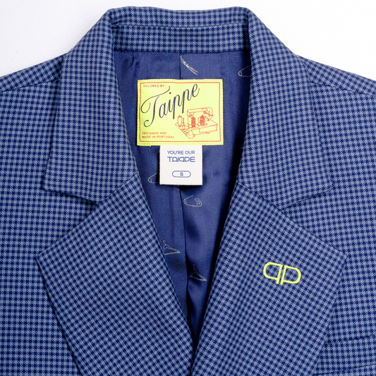 Blue checkered jacket with a brand tag on a white background