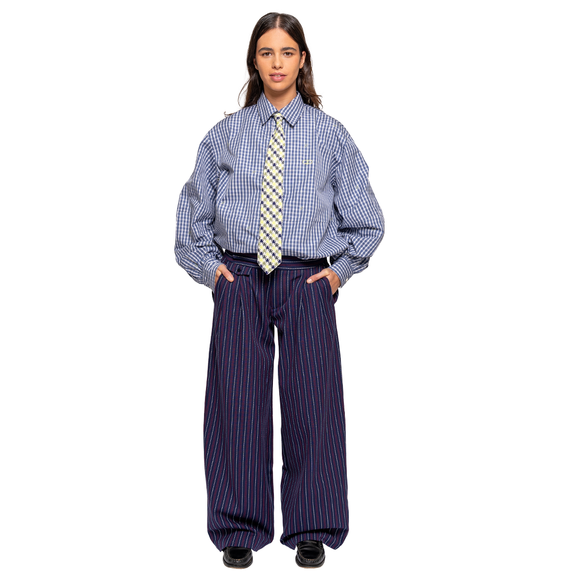 Person wearing a checkered shirt, striped tie, and wide-leg pants on a white background