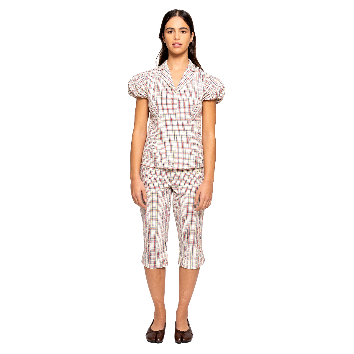 Woman wearing a checkered blouse on a white background