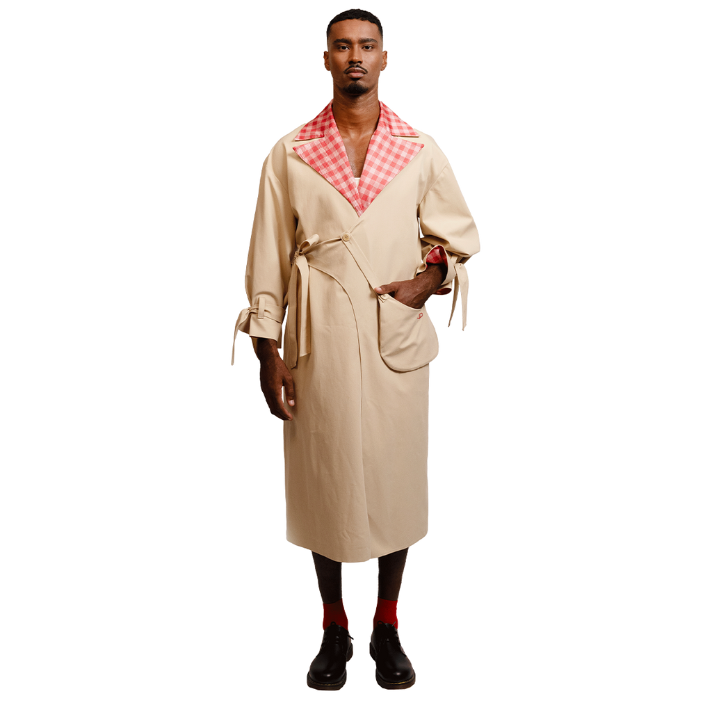 Man wearing a beige coat with a red and white gingham collar 