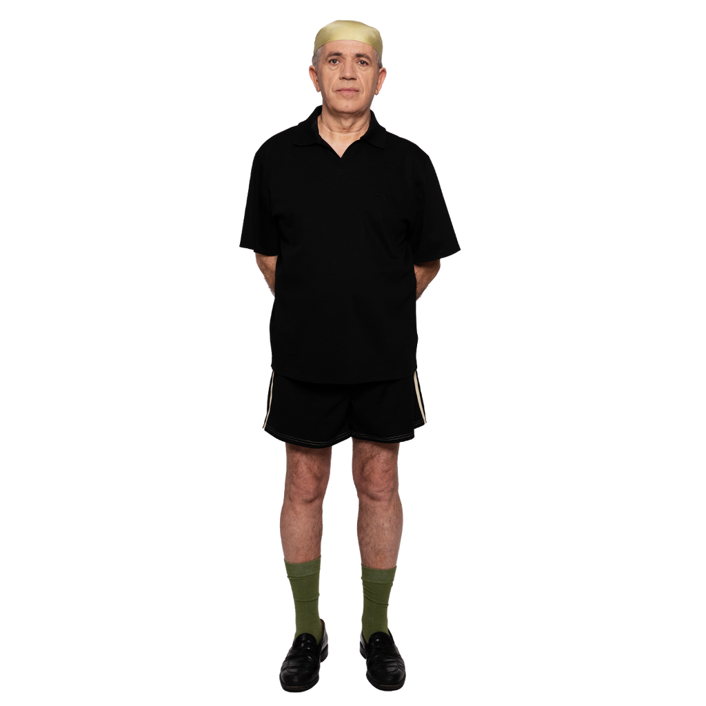 Person wearing a black shirt and shorts set on a white background