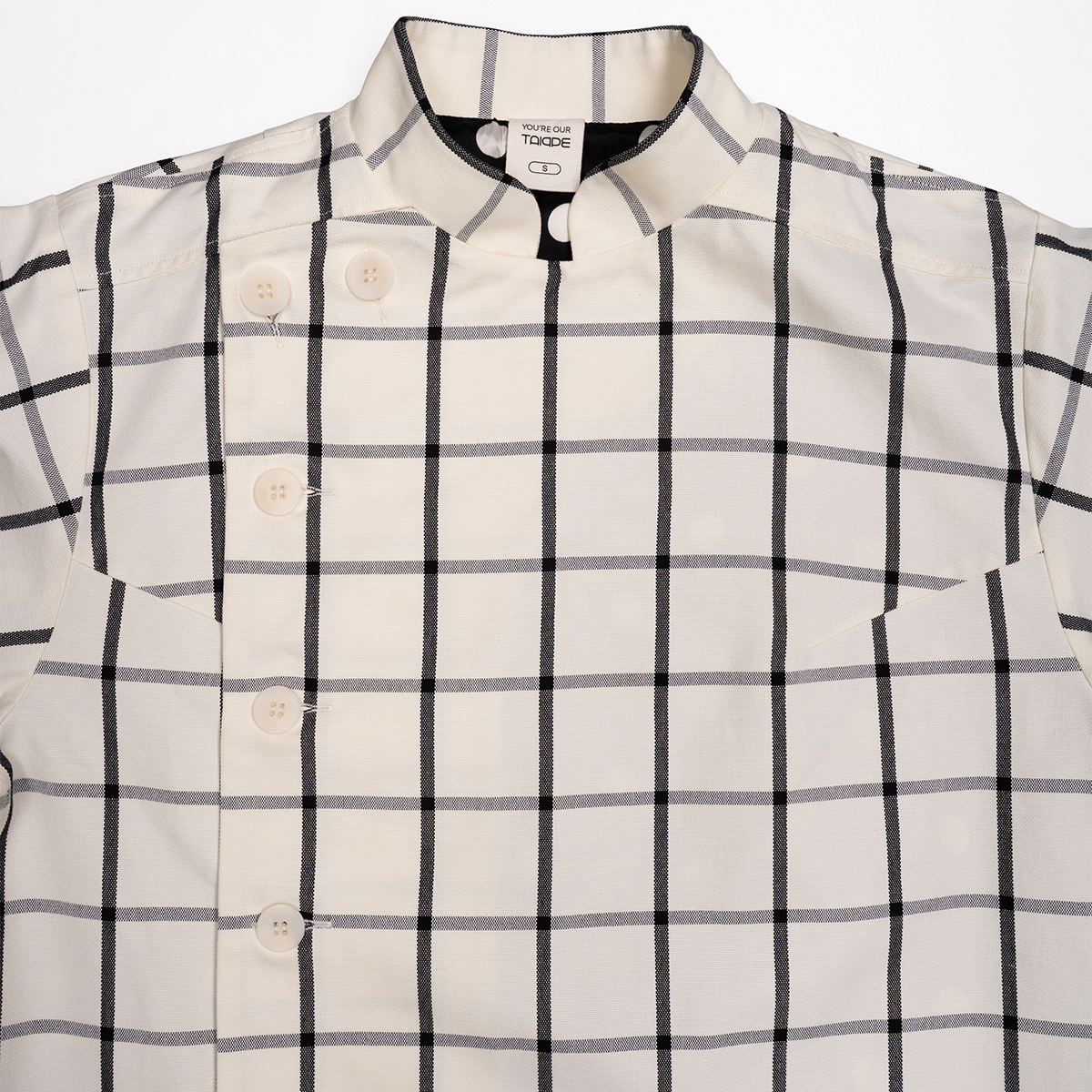 White jacket with black checkered pattern on a white background