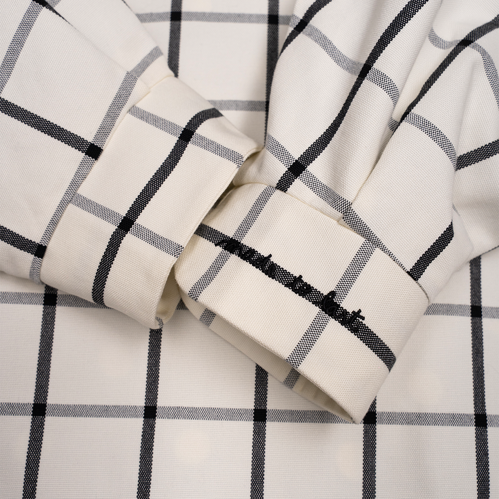 Close-up of checkered fabric with black and white lines