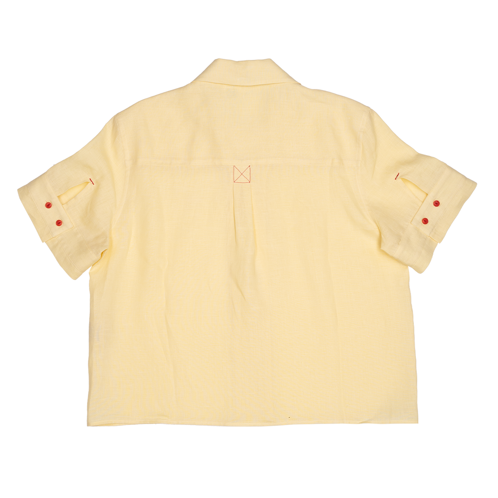 Back view of a light yellow shirt with short sleeves on a white background
