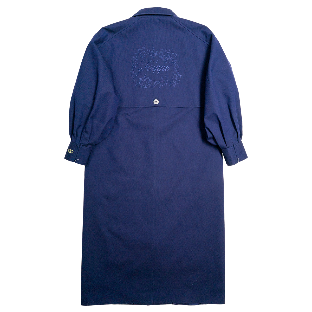 Navy blue coat with embroidered design on the back against a white background
