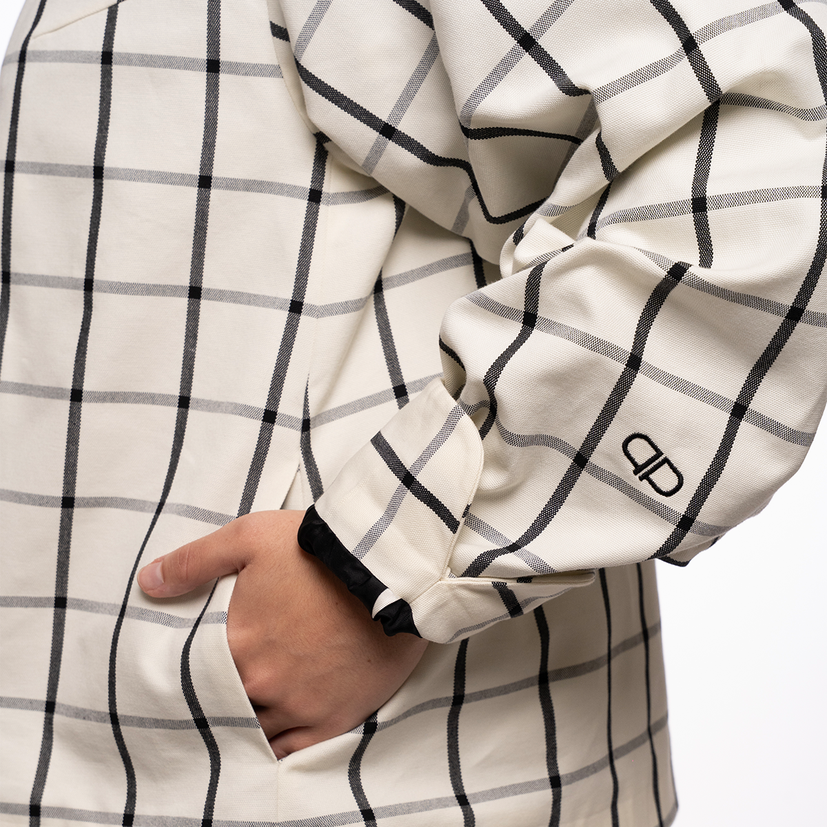 White checkered jacket with black lines and a brand logo on a white background