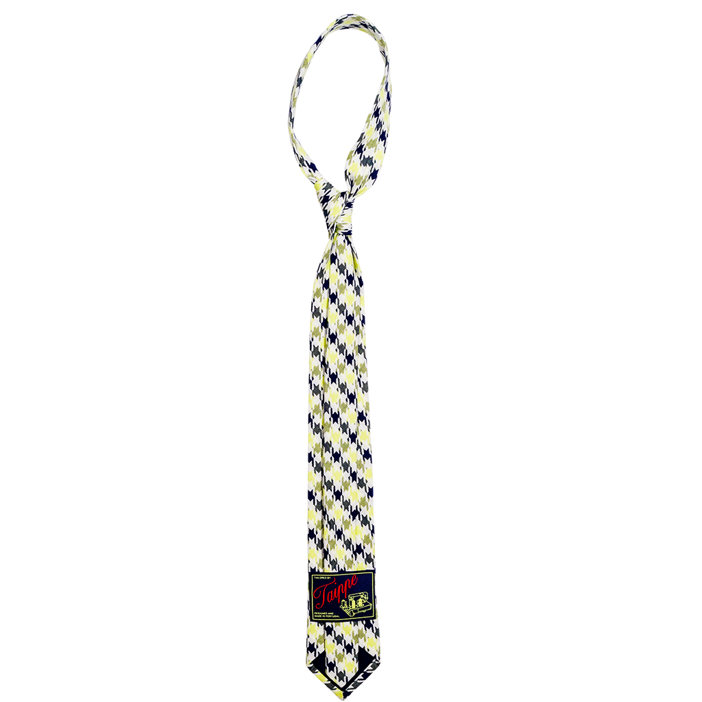 Checkered tie with a brand label on a white background