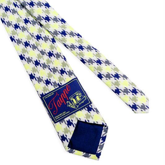 Patterned tie with a brand label on a white background