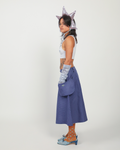 Person wearing a blue skirt on a white background.