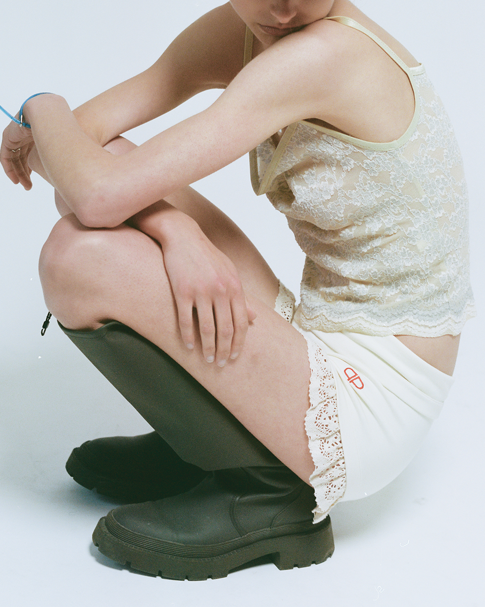 Person wearing mini shorts with a frill hem