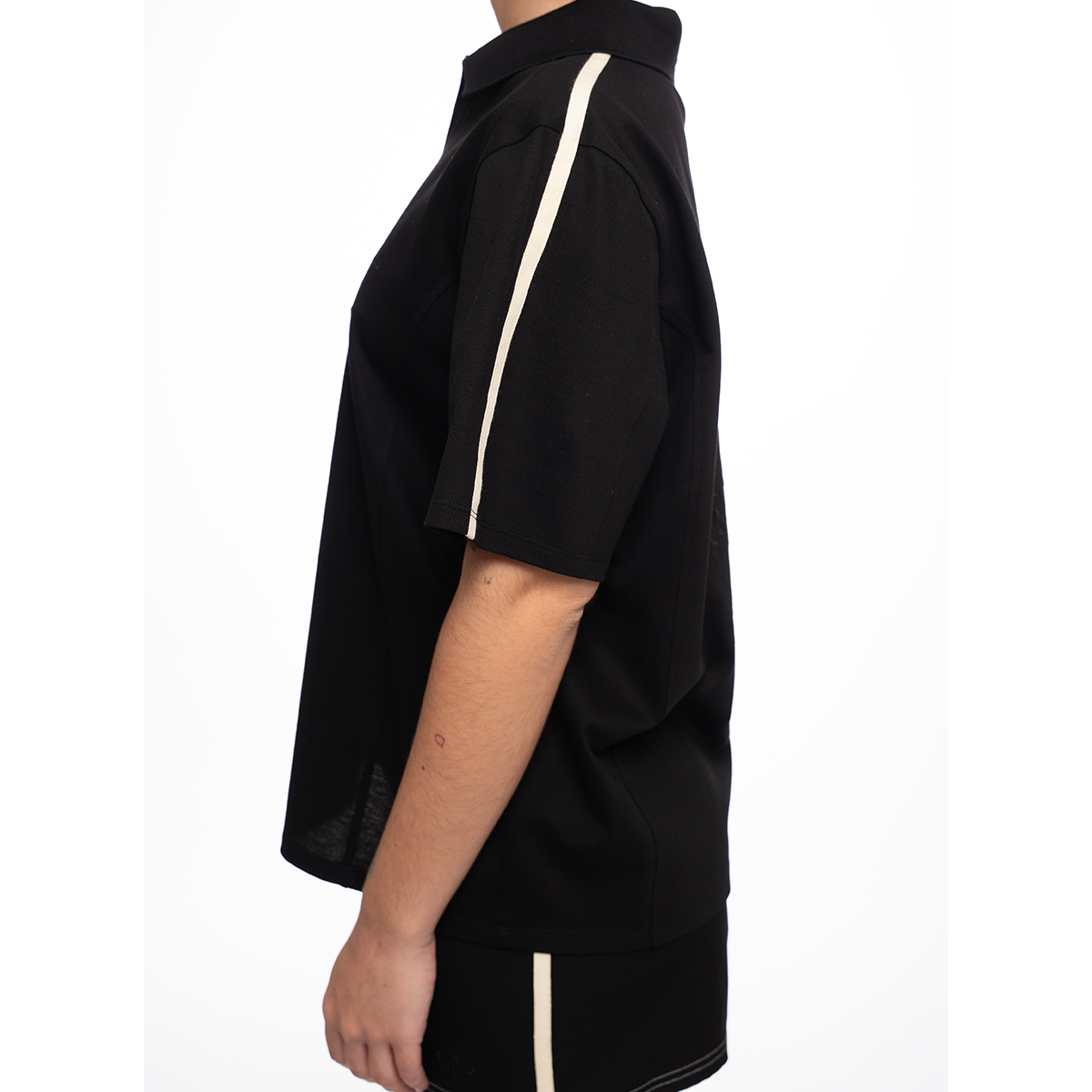 Black outfit with yellow trim on a white background