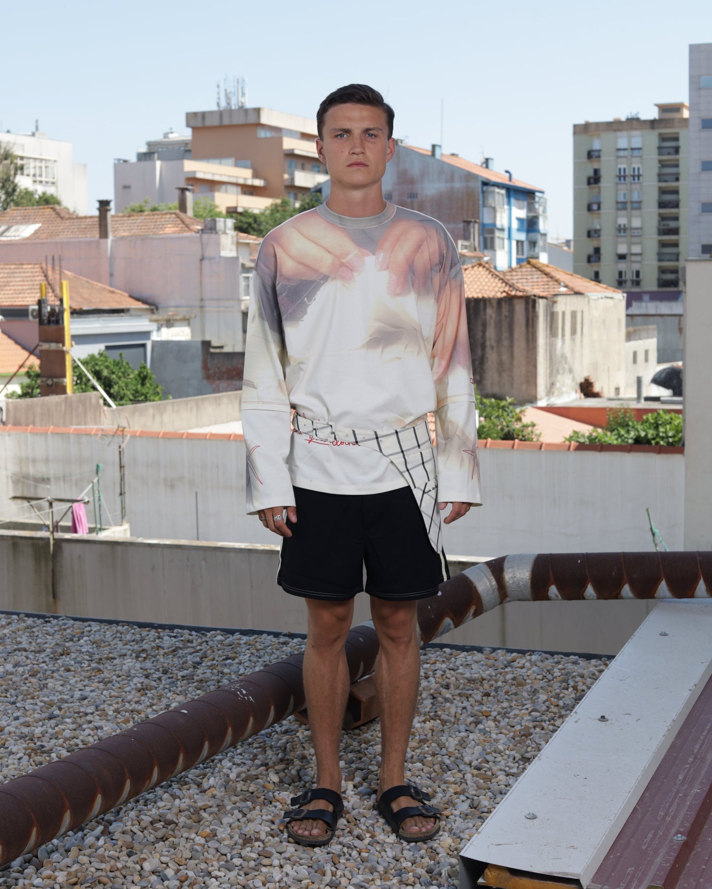 Person wearing a long sleeve graphic t-shirt 