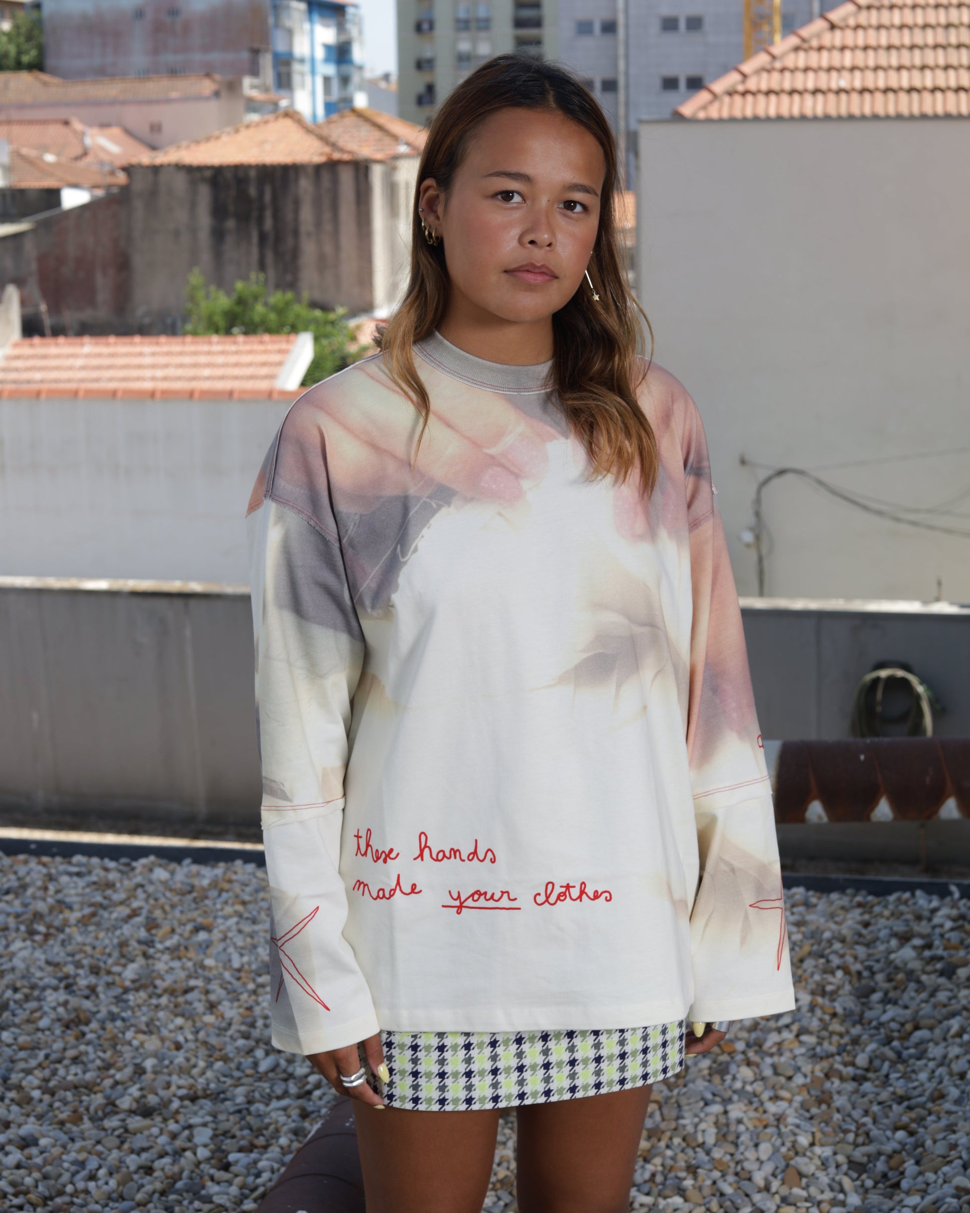 Woman wearing a long sleeve graphic t-shirt