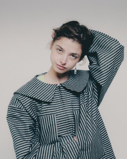Woman in a striped jacket 