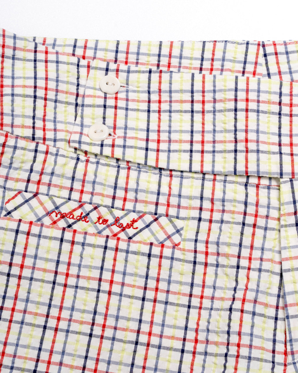 Plaid capris with red and blue lines on a white background