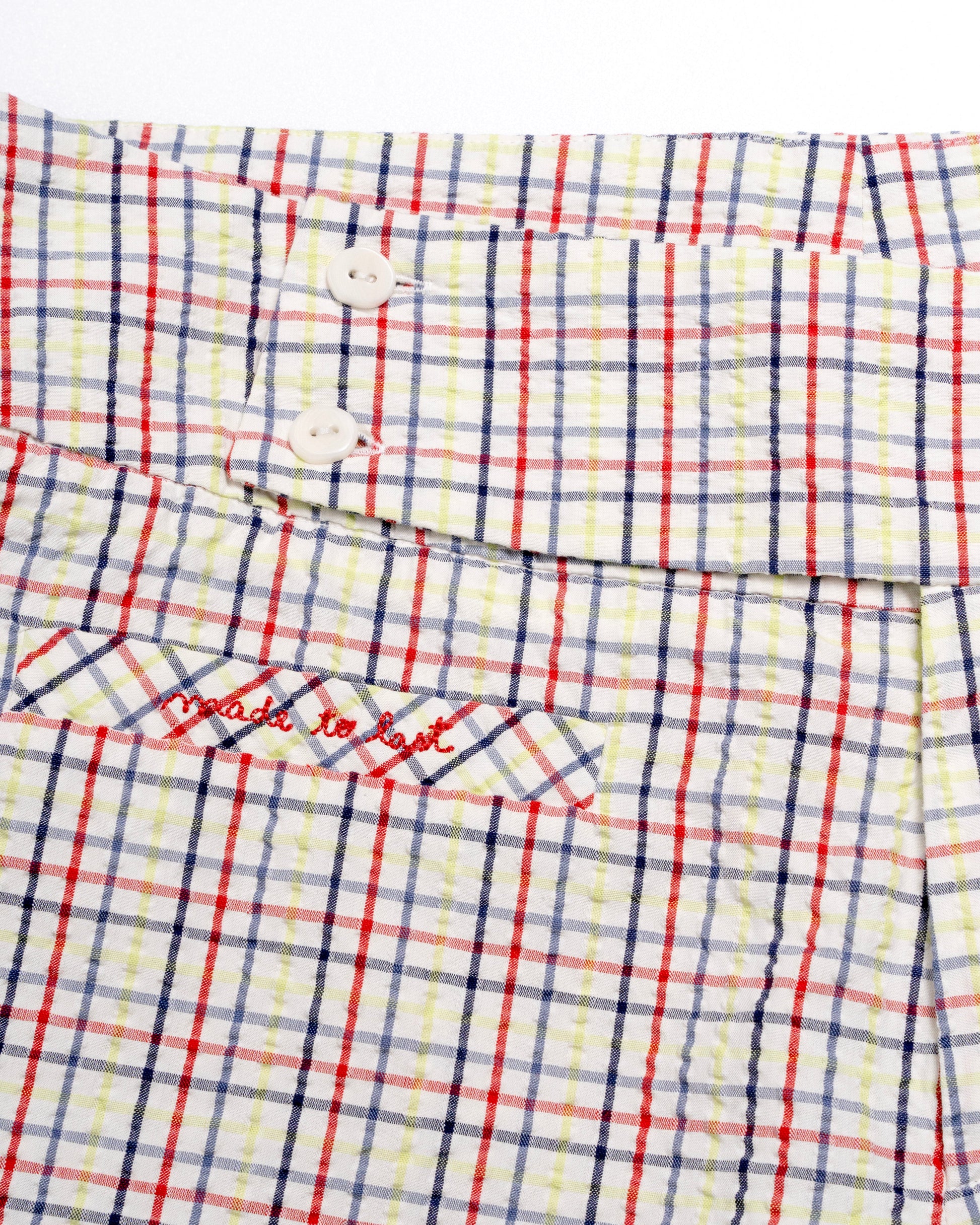 Plaid capris with red and blue lines on a white background